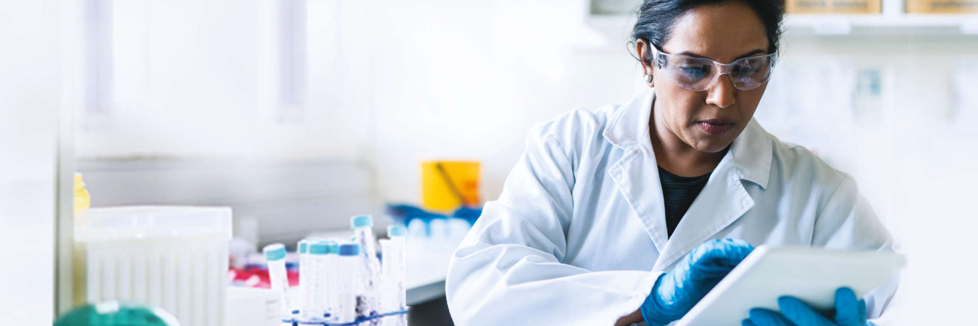 Woman in lab coat working on dPCR and qPCR